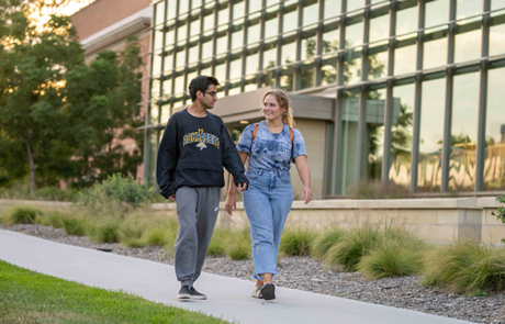 two students walking on college campus