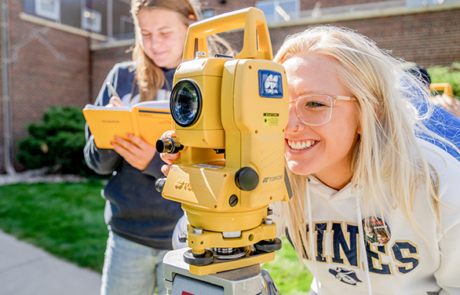 student working on a robot